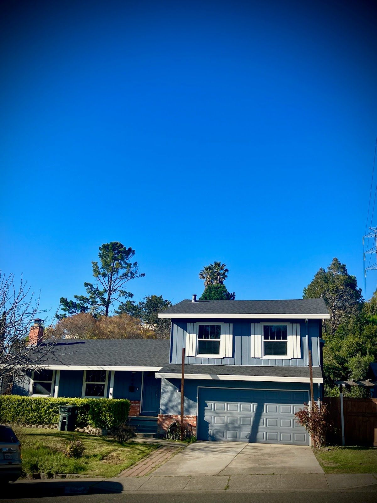 A house with a blue sky in the background