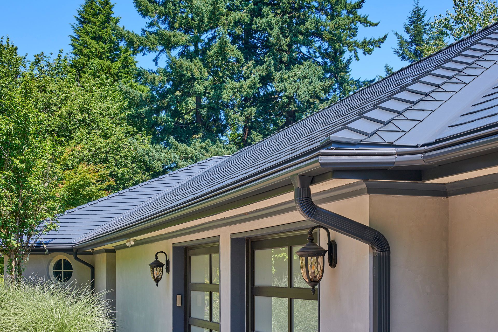 An aerial view of a house in Portland, Oregon with a Deep Charcoal Interlock Slate Roof.