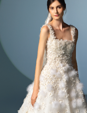 A woman is wearing a white wedding dress and veil.