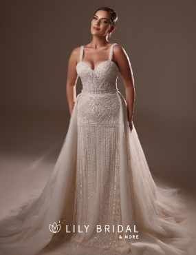 A woman is wearing a white wedding dress from lily bridal