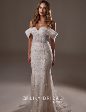 A woman is wearing a wedding dress from lily bridal
