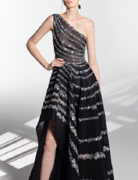 A woman is wearing a black one shoulder dress