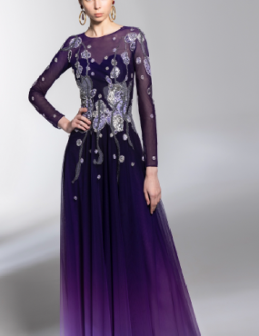 A woman is wearing a purple dress with long sleeves