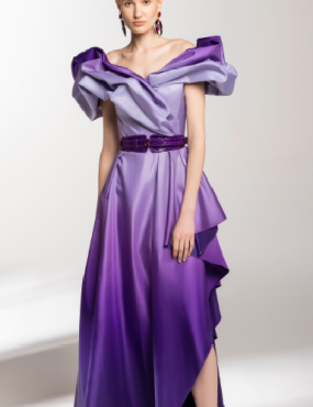 A woman is wearing a purple dress with a purple belt