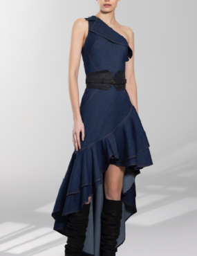 A woman is wearing a blue dress and black boots