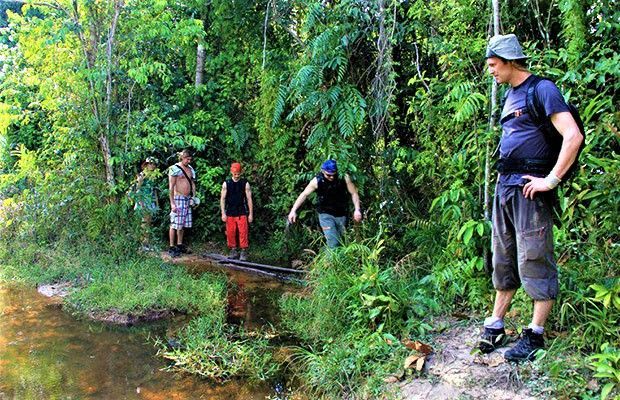 Tourists exploring Angkor Wat during a private Cambodia 14-day guided adventure.