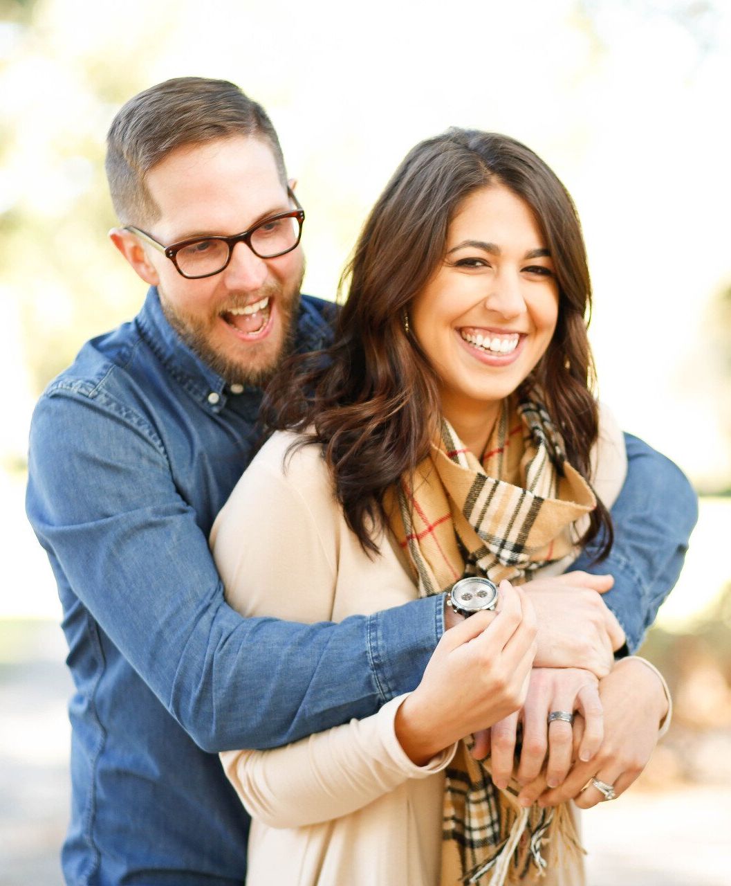 Couple smiling and holding each other | Dental implant services in Metairie LA 70002