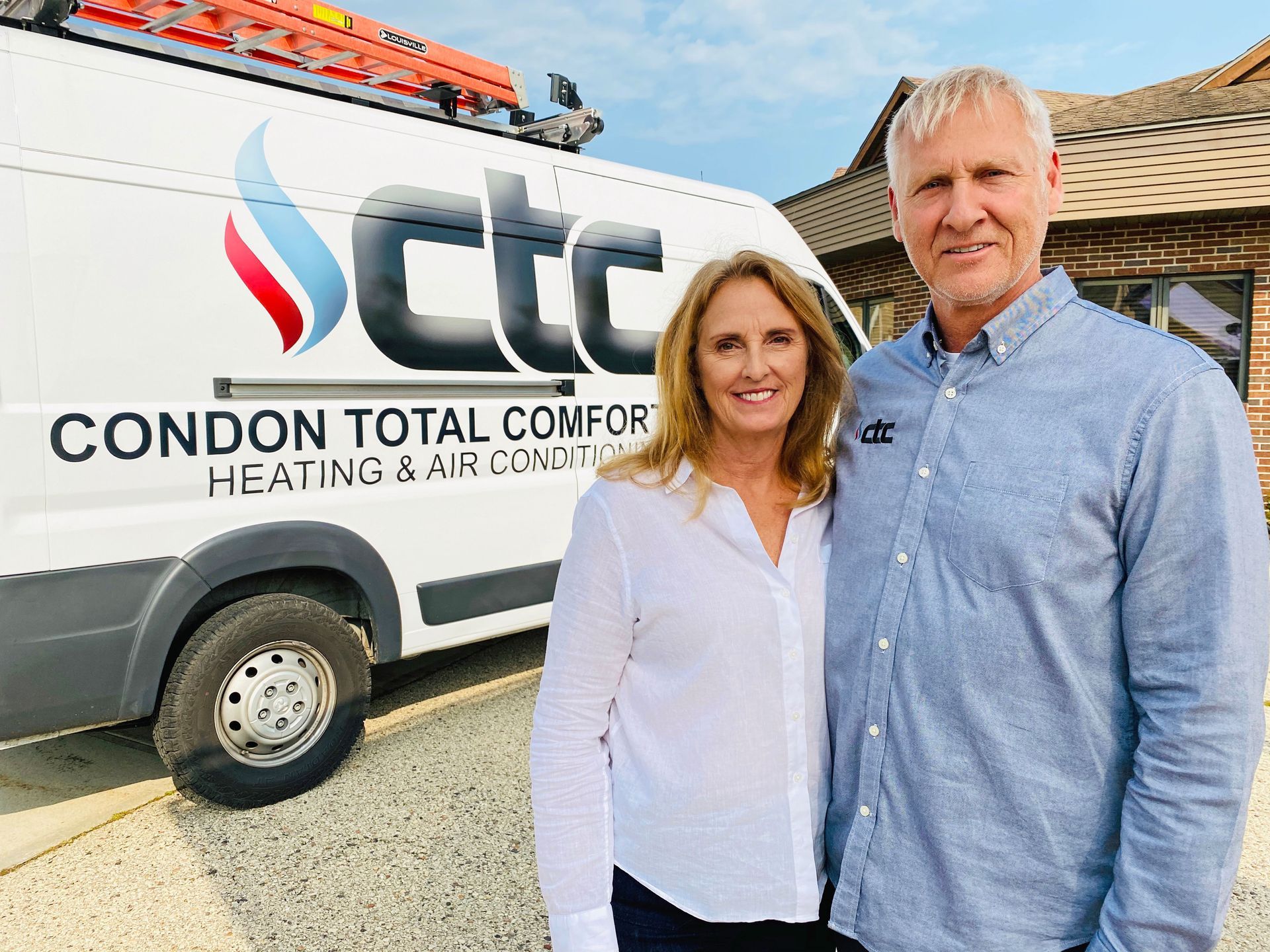 Dennis and Debra Werch standing in front of a Condon Total Comfort Service van.