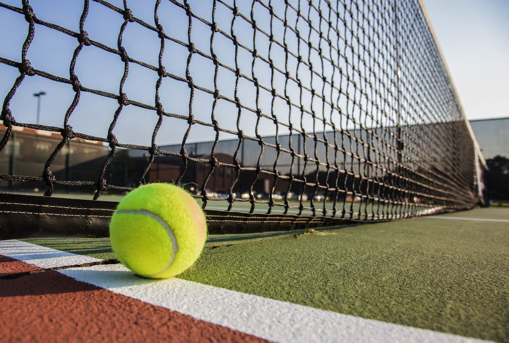 Tennis Court With Tennis Ball — Professional Pool Builder in Cootamundra, NSW