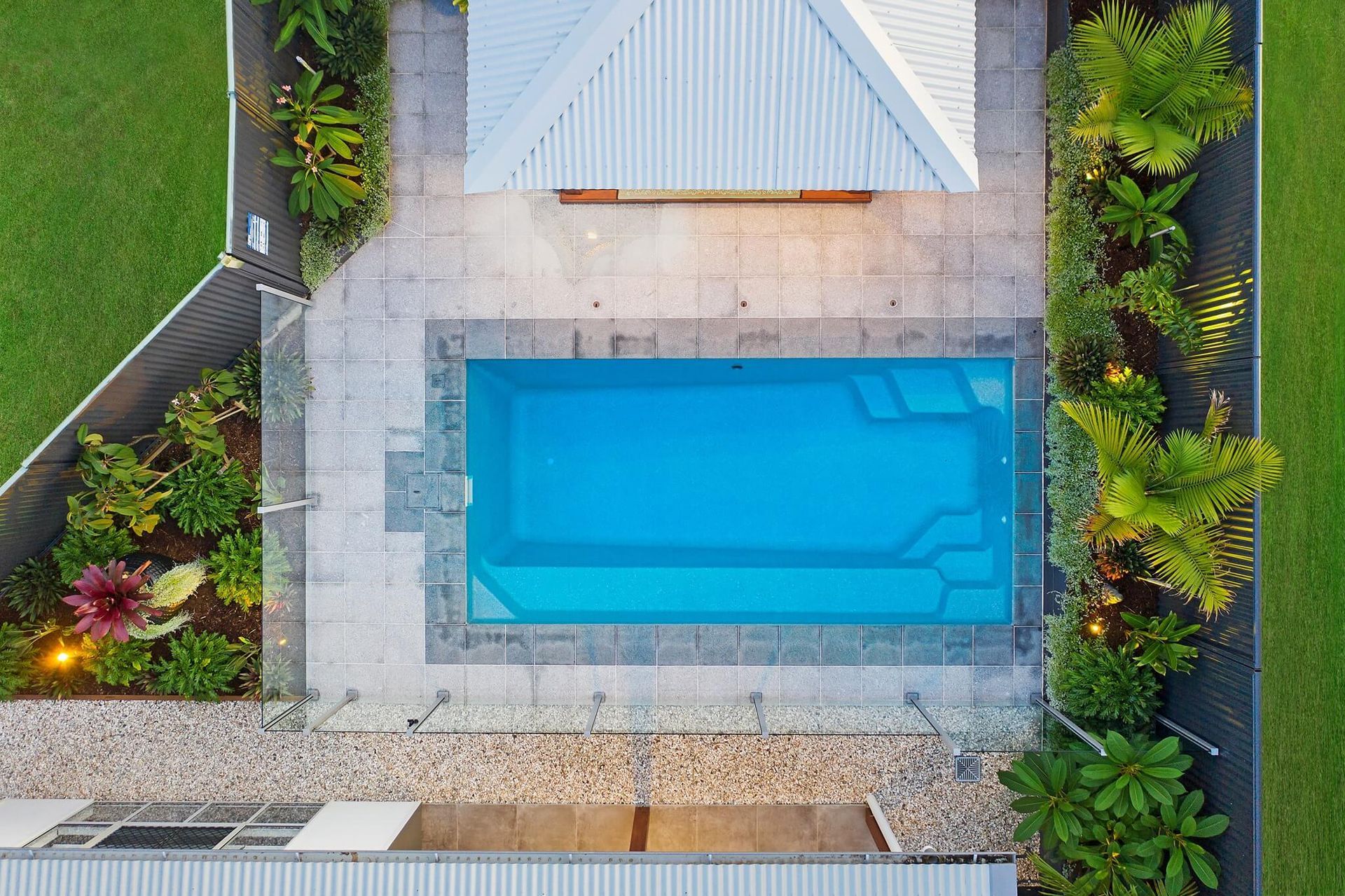 A Builder Sprays Gunite To Create A Suburban Pool — Professional Pool Builder in Wagga Wagga, NSW