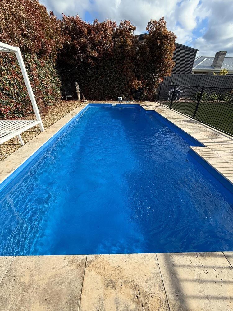 Backyard Swimming Pool with Blue Tiled Floor