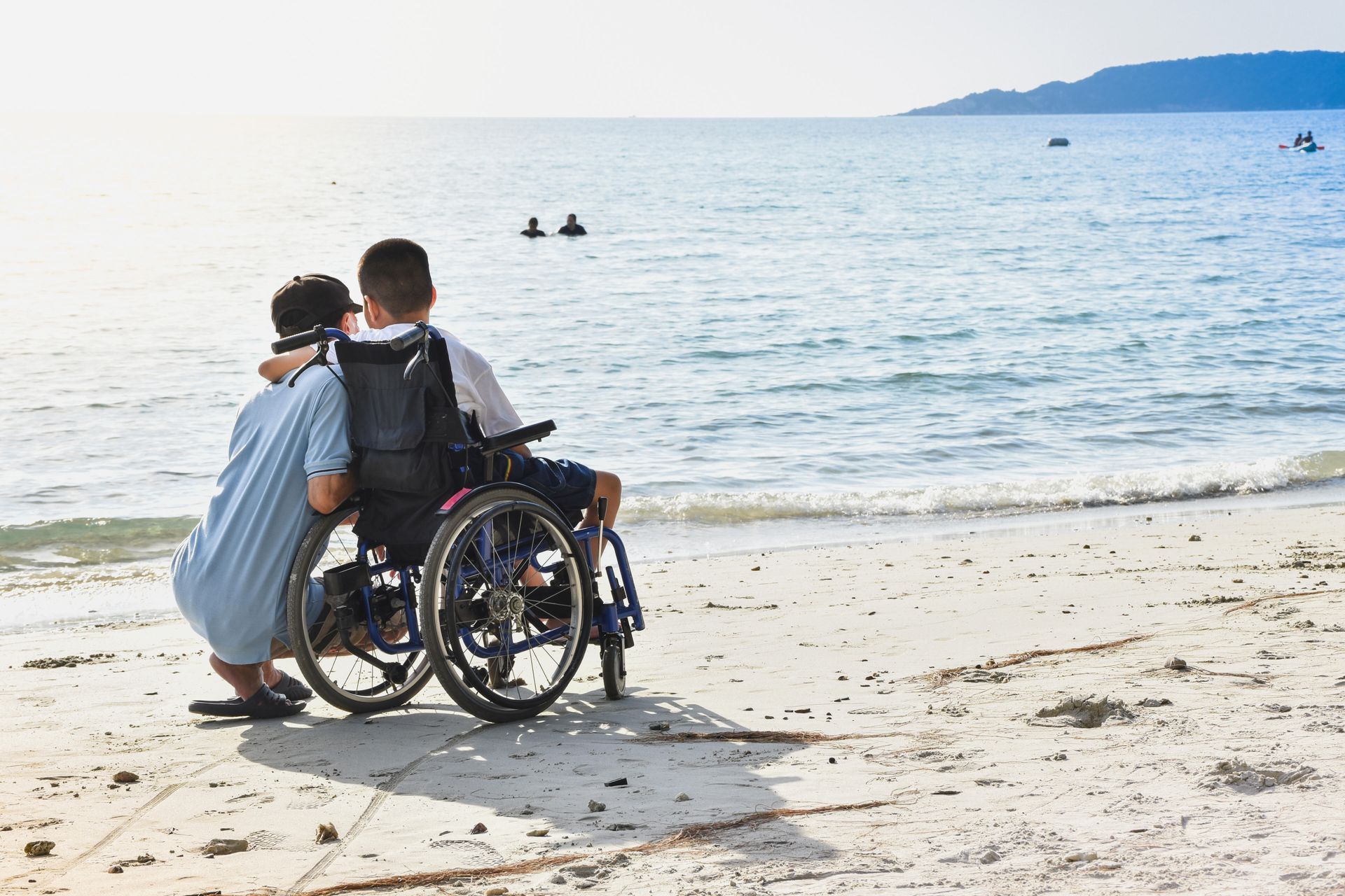 Manual wheelchair in use by the beach