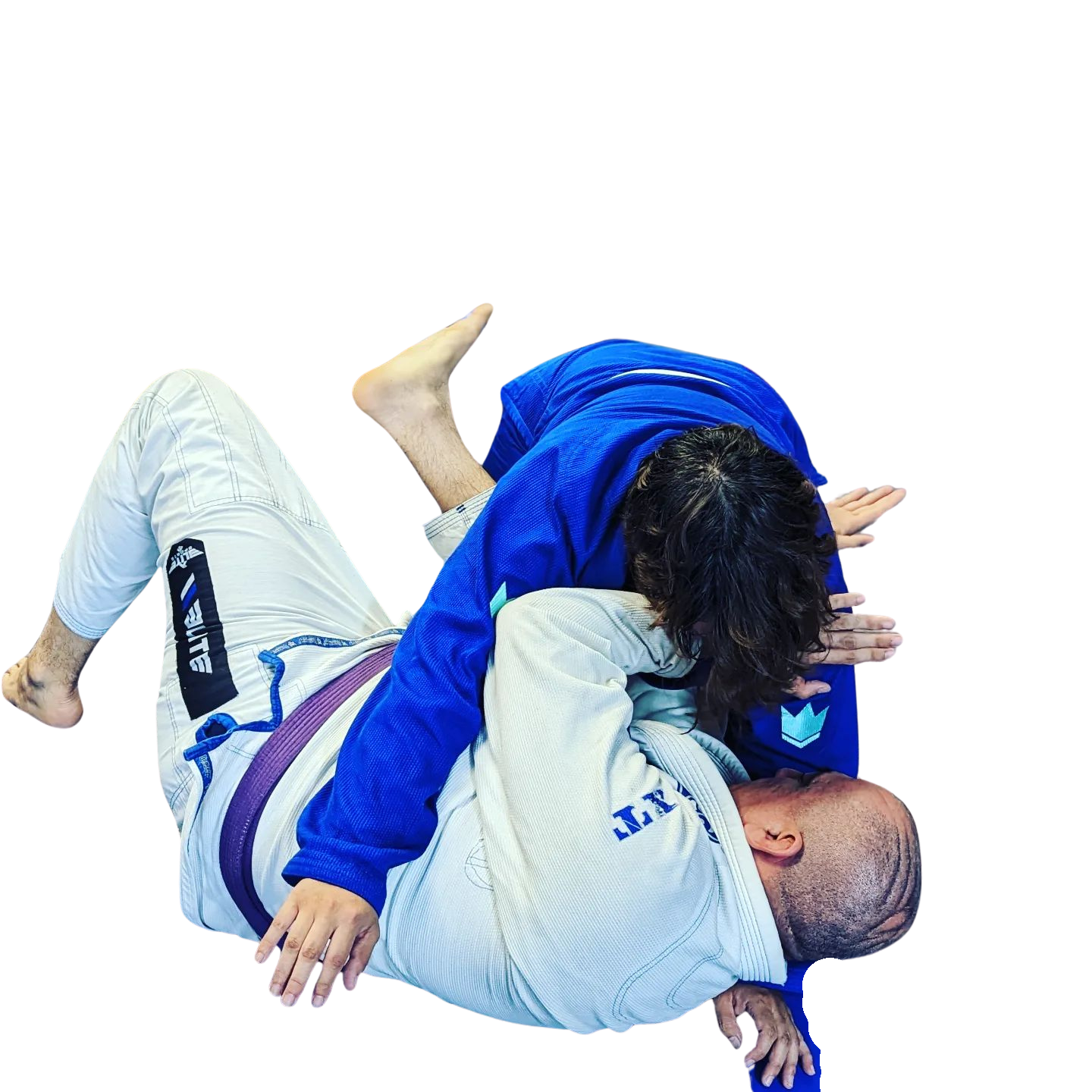 two men are fighting each other in a jiu jitsu match