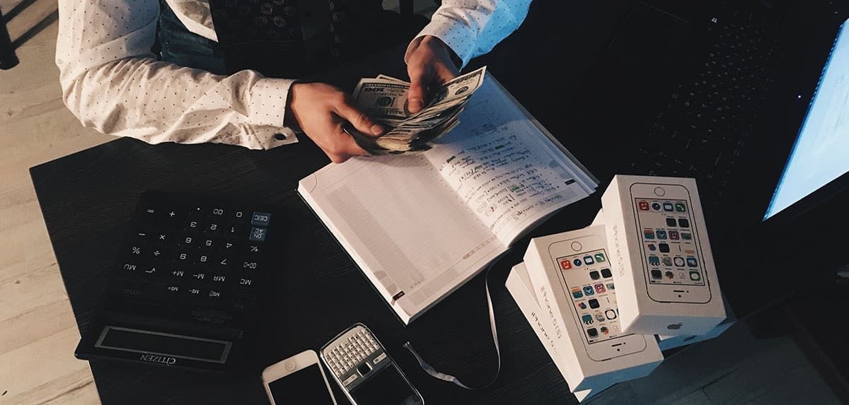 A Man Is Counting Money — Sunshine Coast Financial Advisers in Maroochydore, QLD