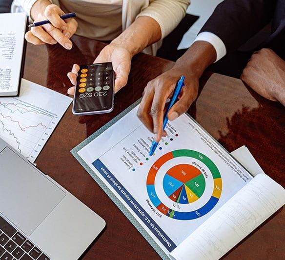 Person Pointing at A Pie Chart on A Piece of Paper — Sunshine Coast Financial Advisers in Maroochydore, QLD