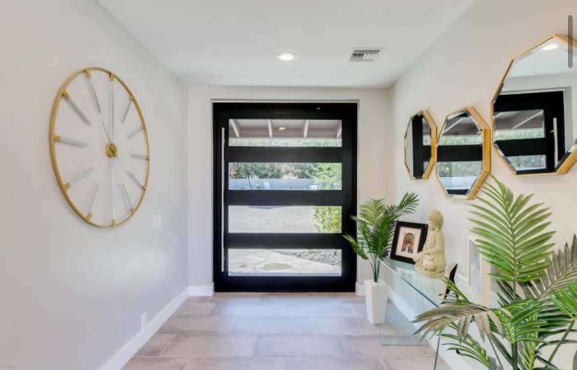 Air conditioning units with toolbox and gloves in backyard.