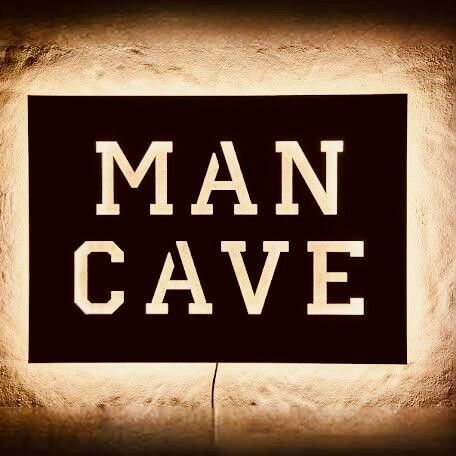 a sign that says man cave on it