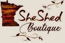 it is a logo for a boutique called she shed boutique