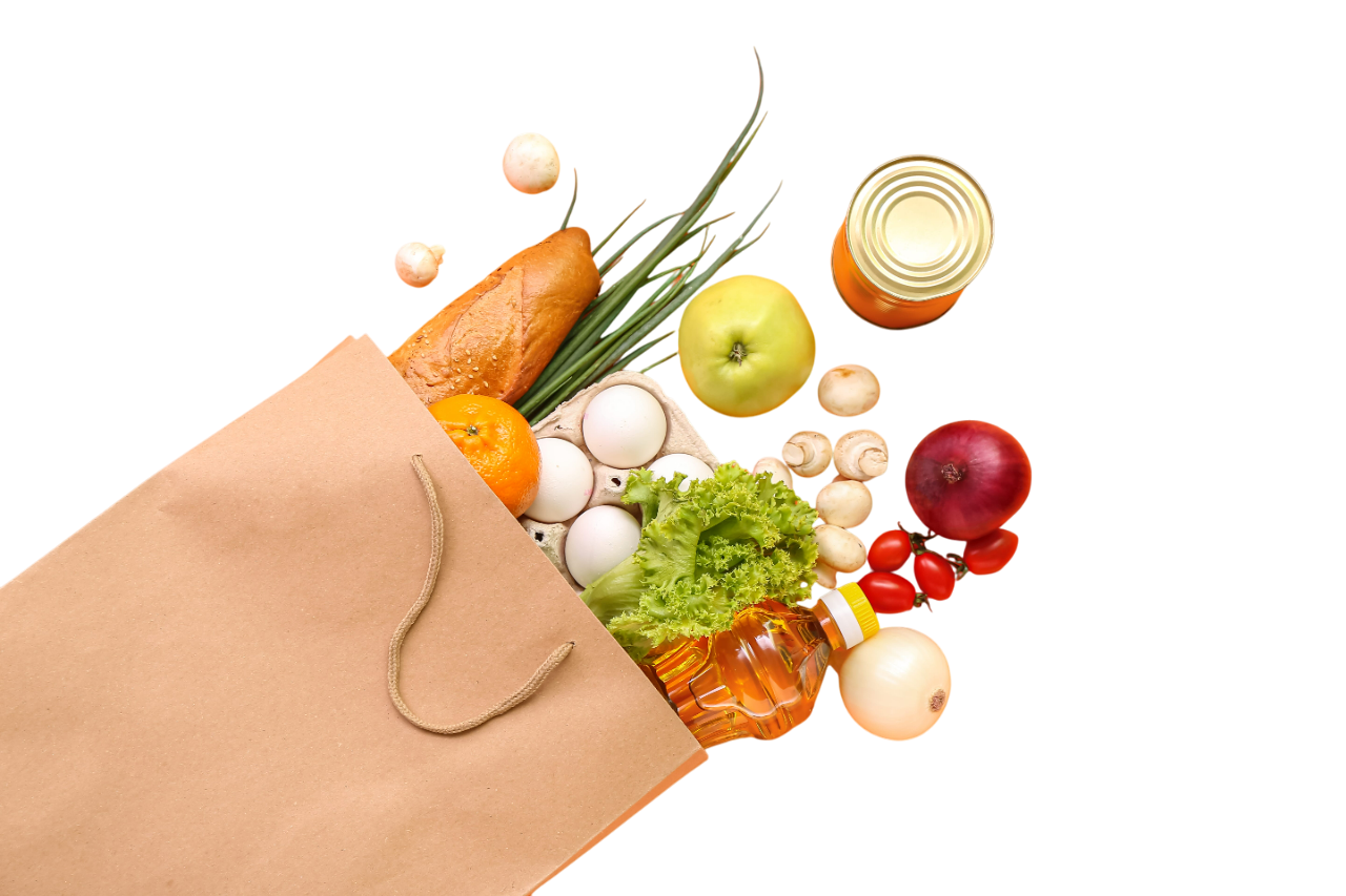 A brown paper grocery bag spilling with various fresh produce, including bread, fruit, vegetables, and eggs.