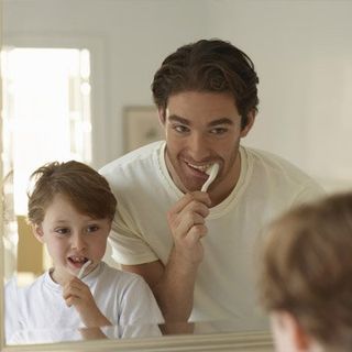 Father & Son Brushing Teeth —  Cosmetic Bonding in Silver Spring, MD