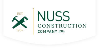 Nuss Construction Company logo in dark green with a hammer and handsaw icon and the text "EST. 1967".