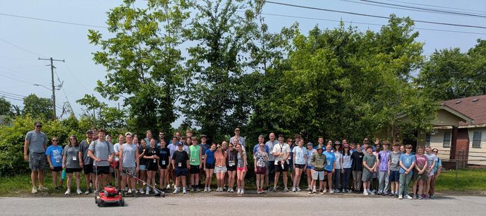 YM360's youth volunteers gather to work on rehab projects with CNE.