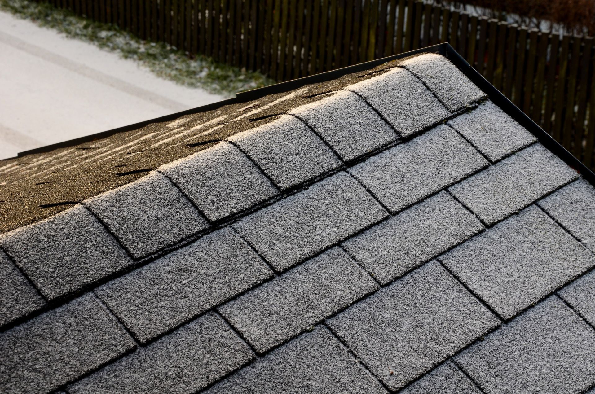A close up of a roof with shingles on it.