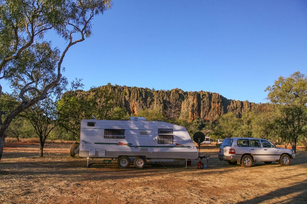 Caravan and Suv Parked in a Dry, Open Area — The Caravan Clinic in Ballina, NSW