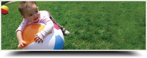 Baby Playing a ball - Child Care in Lafayette, CO