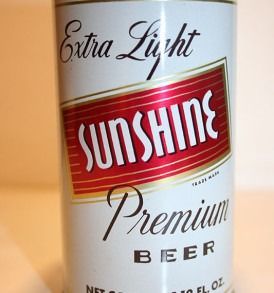 Sunshine Extra Light premium beer can label in red, white, and gold