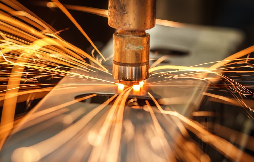 A Close Up Of A Machine Cutting A Metal - Gold Coast Laser And Pipe Bending In Mudgeeraba, QLD