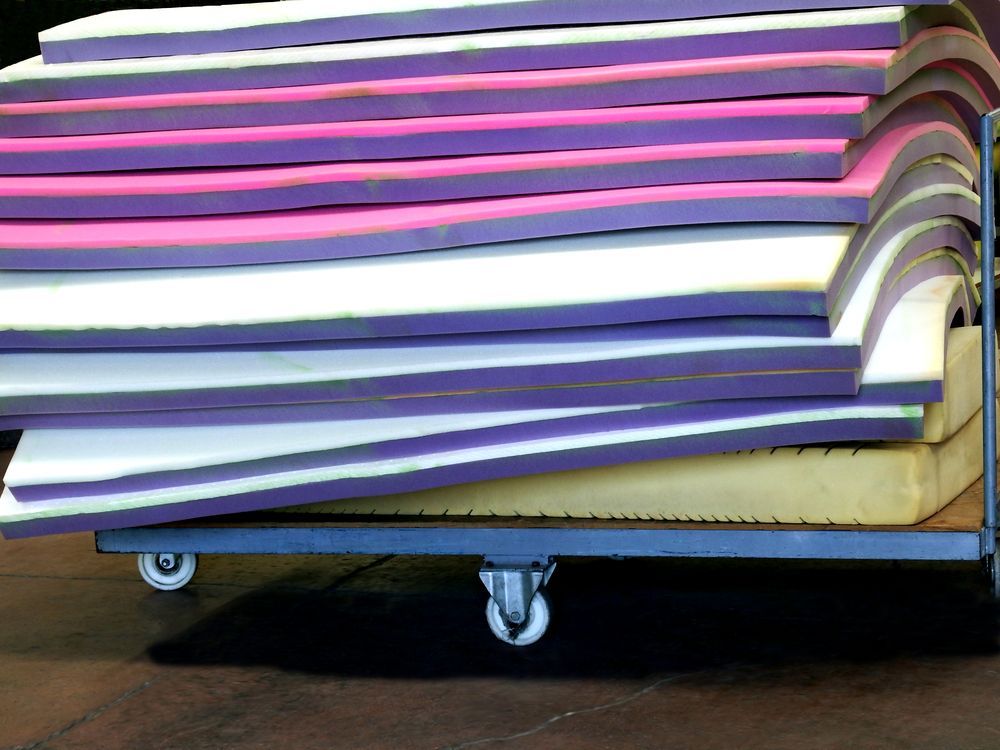Cart Holding a Stack of Colorful Foam Mats — Gold Coast Laser And Pipe Bending in Mudgeeraba, QLD