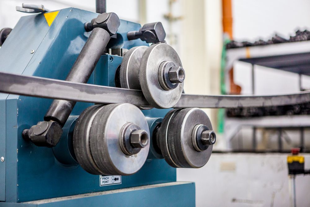 A Machine Is Bending A Piece Of Metal In A Factory - Gold Coast Laser And Pipe Bending in Mudgeeraba, QLD