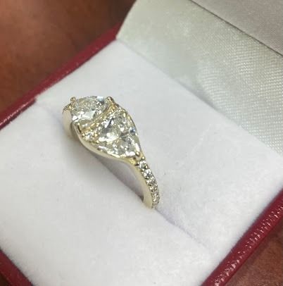 Diamond engagement ring in a red velvet box.