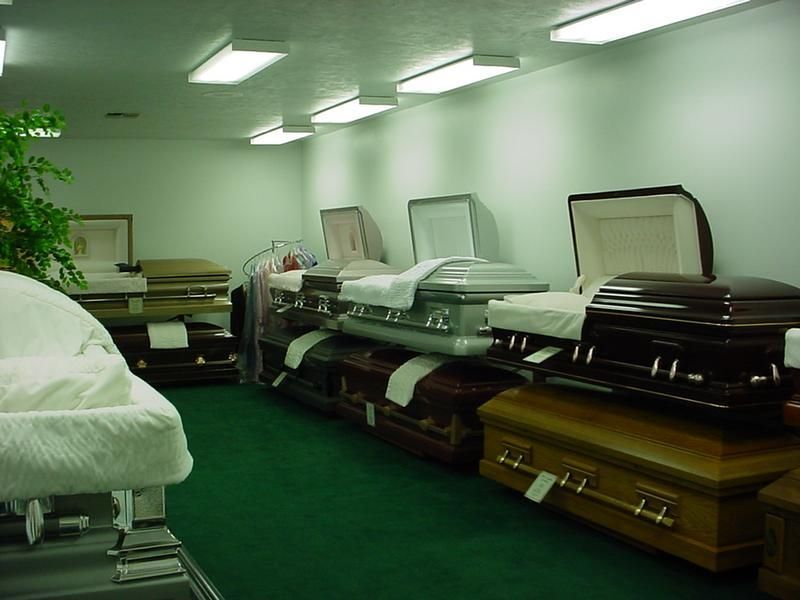 a row of coffins are lined up in a room