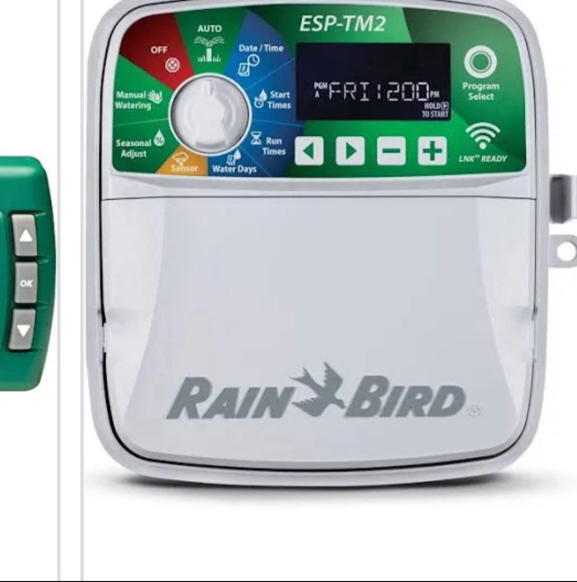 Rain Bird ESP-TM2 irrigation timer with digital display, buttons, and remote control.