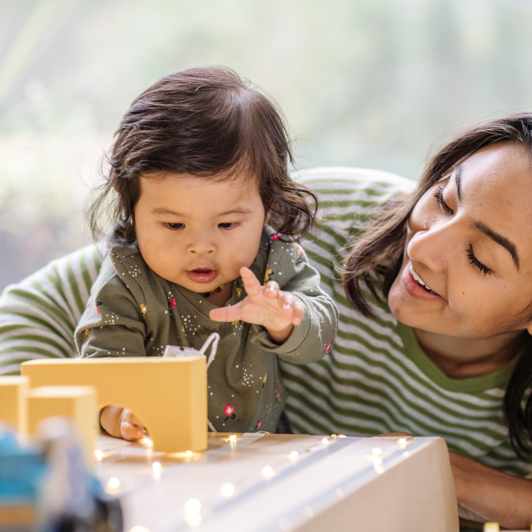 Basket overflowing with colorful vegetables and fruits, including peppers, broccoli, apples, and lettuce.