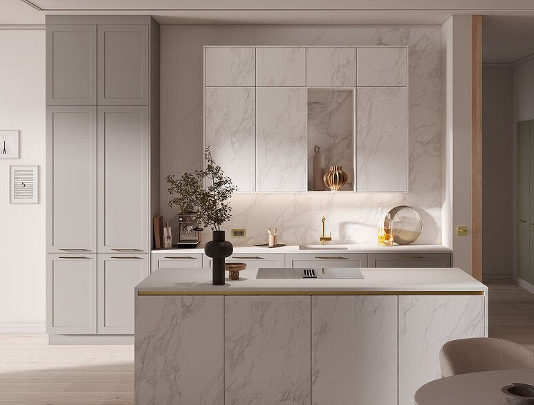 Modern kitchen with marble-patterned cabinetry and island. Gray and beige tones. Decorative gold accents.