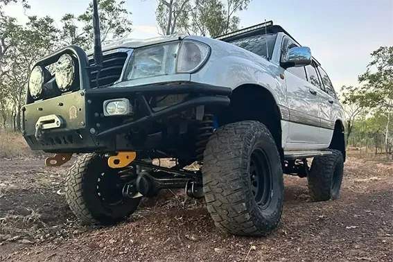 A White 4WD with Bullbar Driving on a Track in the Outback — Mudpig Mechanical In Humpty Doo, NT