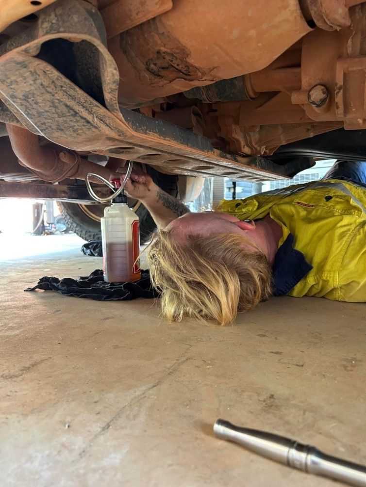Mechanic Under Car, Draining Fluids — Mudpig Mechanical In Humpty Doo, NT
