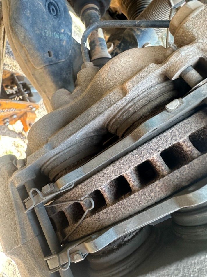 Close-up of Rusty Brake Pads and Rotor on a Vehicle — Mudpig Mechanical In Humpty Doo, NT