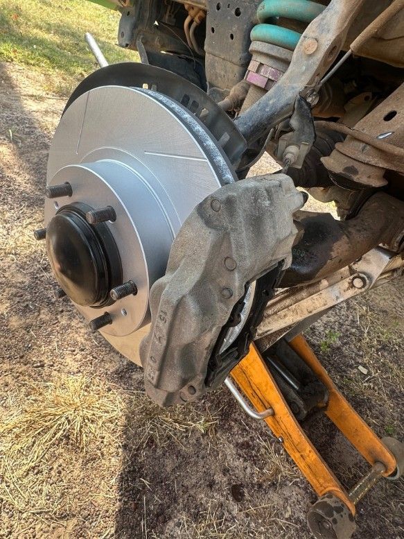 New Brake Rotor Installed on a Car Wheel — Mudpig Mechanical In Humpty Doo, NT