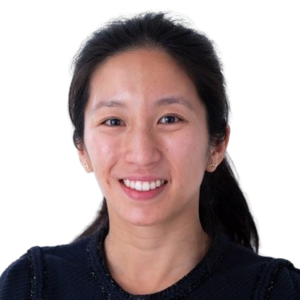 A woman in a black shirt is smiling for the camera