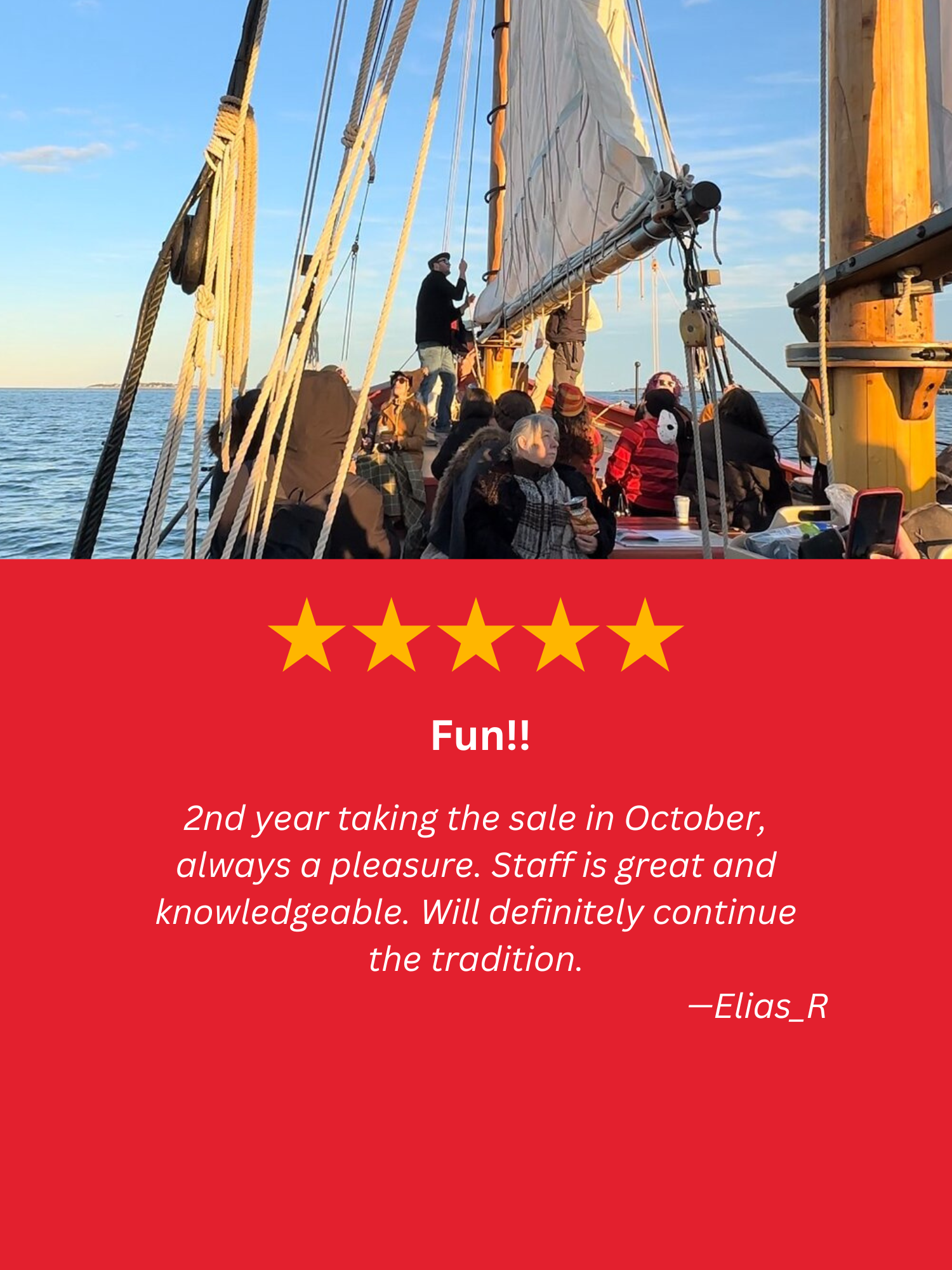 A group of people are sitting on top of a sailboat in the ocean.