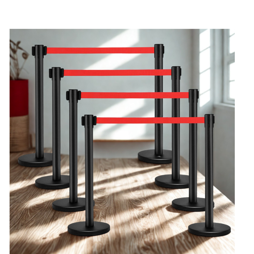 A bunch of black poles with red ribbons on them