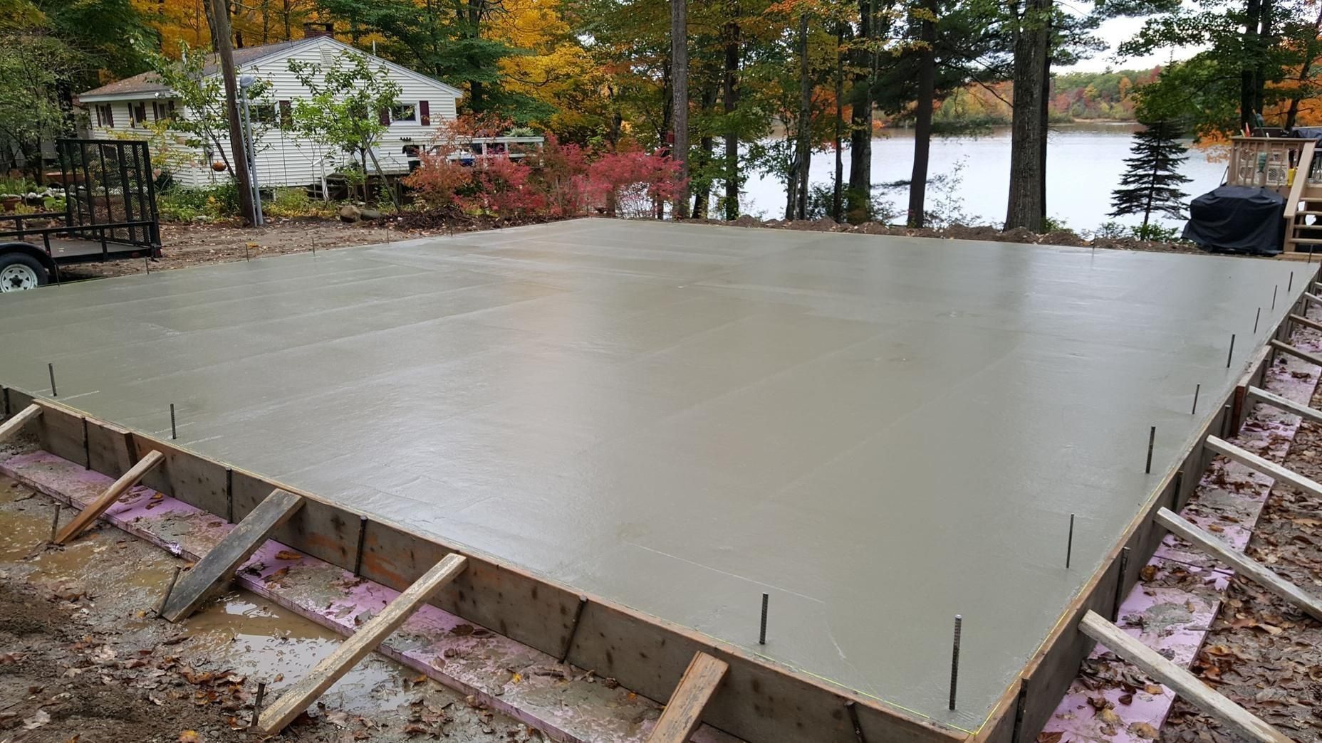 a man is installing a counter top in a kitchen .