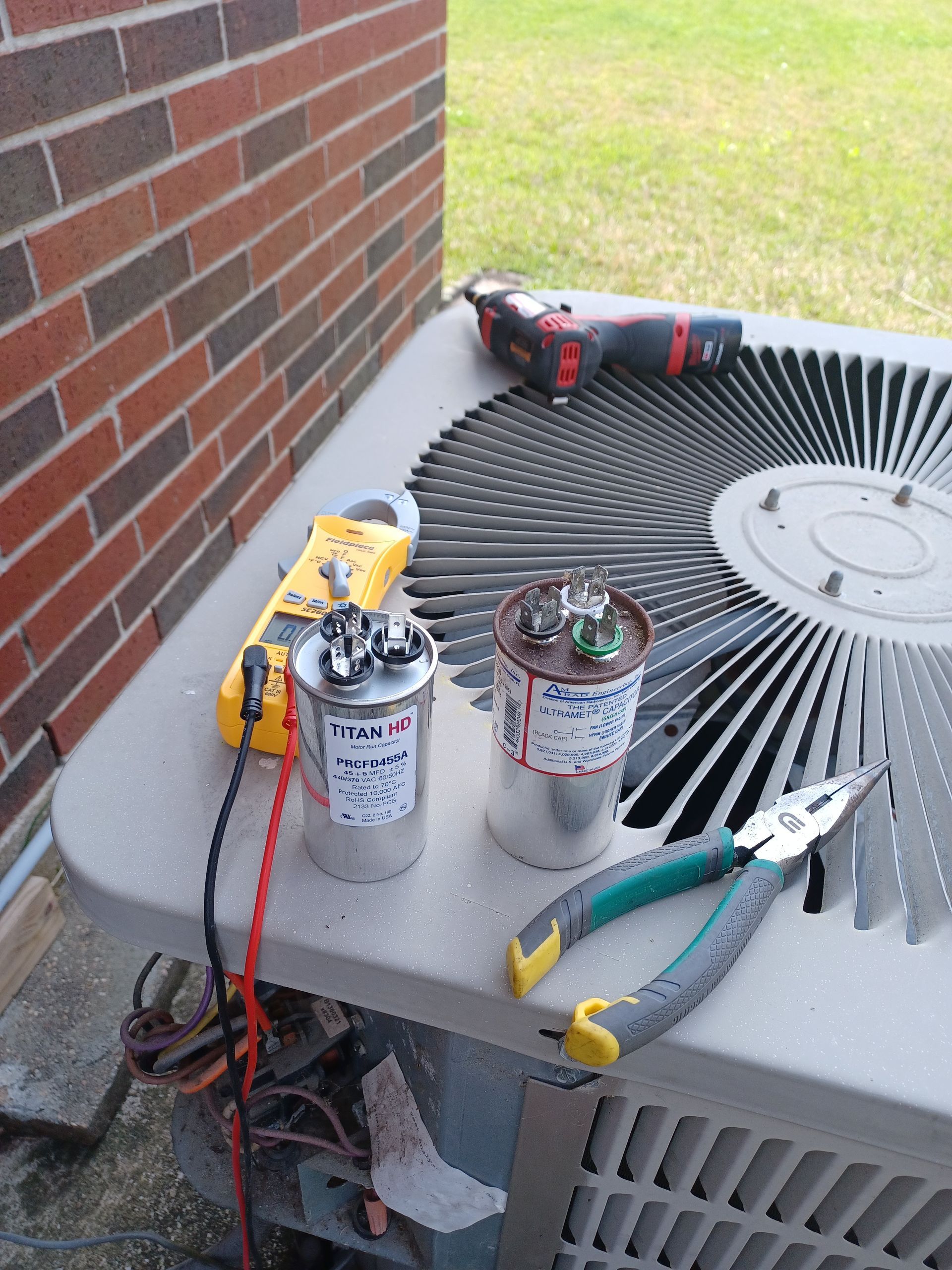 HVAC capacitor testing and replacement by Arnett Mechanical technician in Rosharon TX