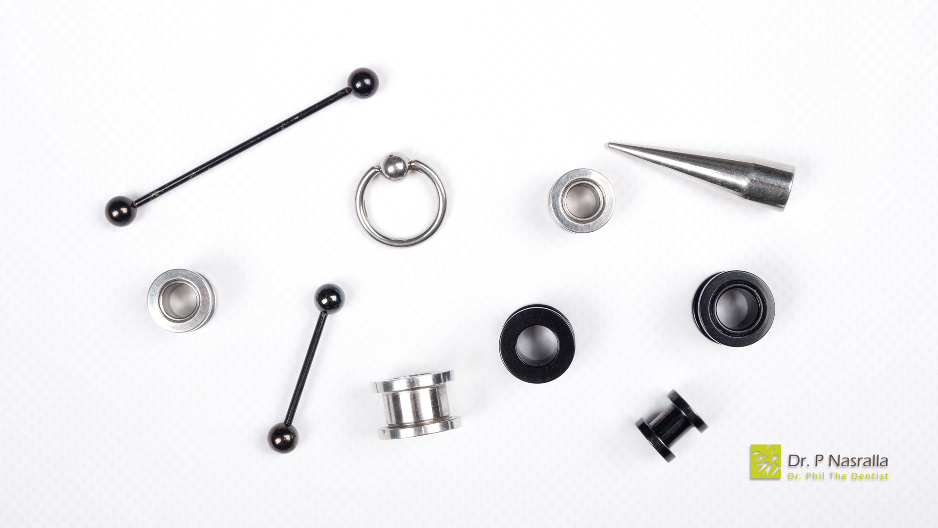 There are many different types of piercings on a white surface.