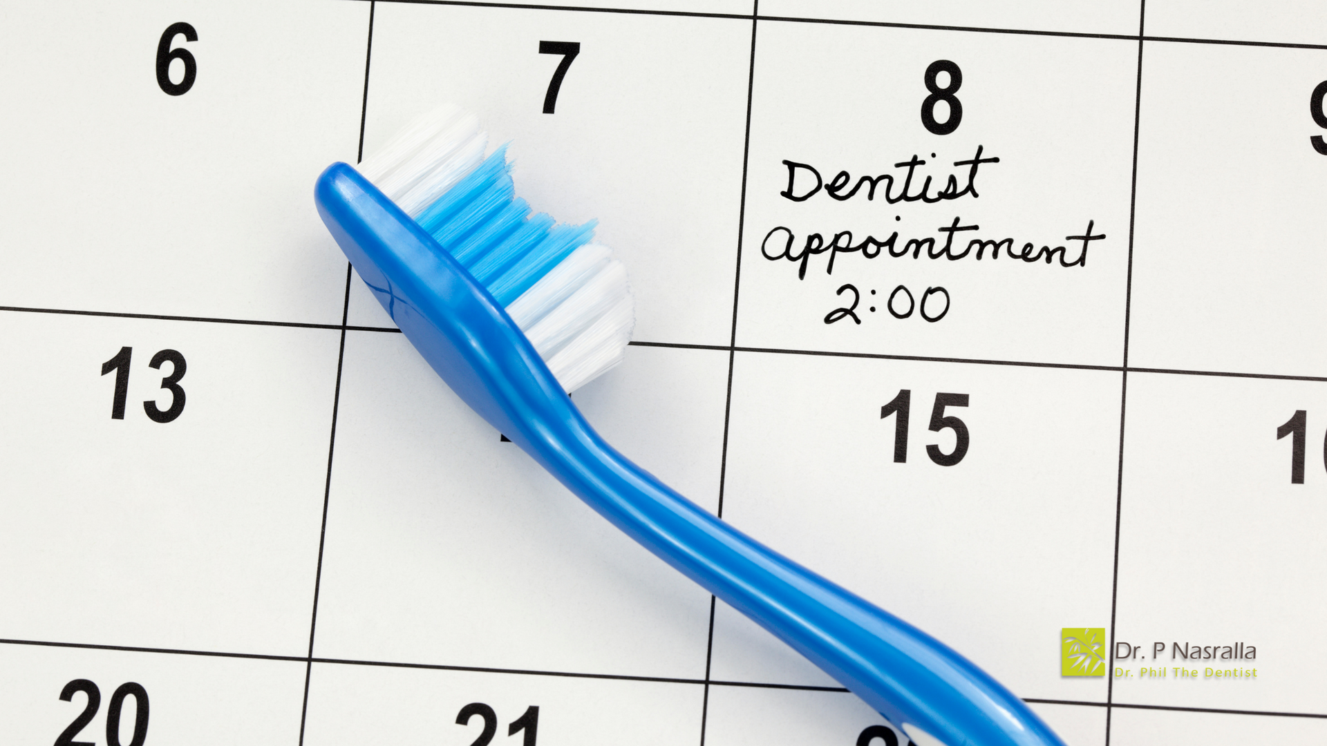 A blue toothbrush is on a calendar that says dentist appointment