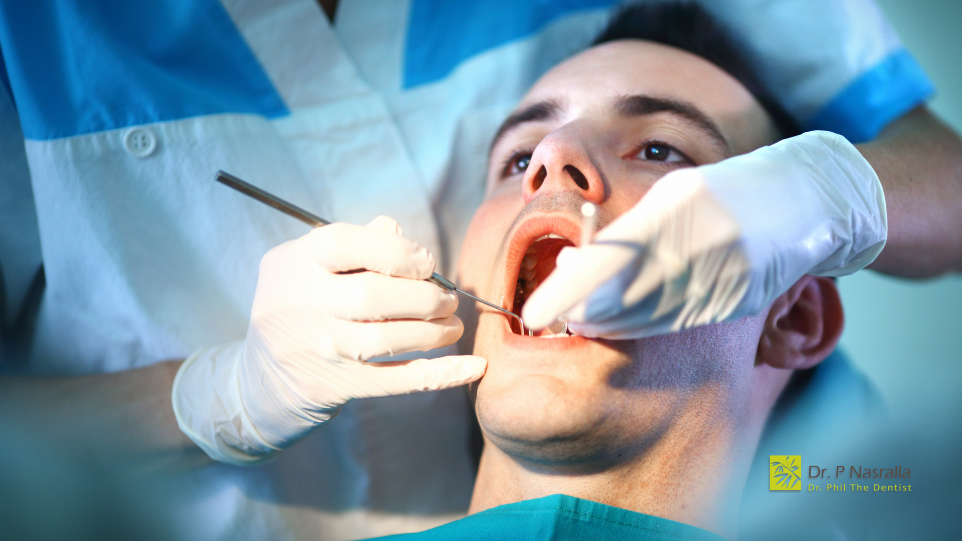 A man is getting his teeth examined by a dentist.